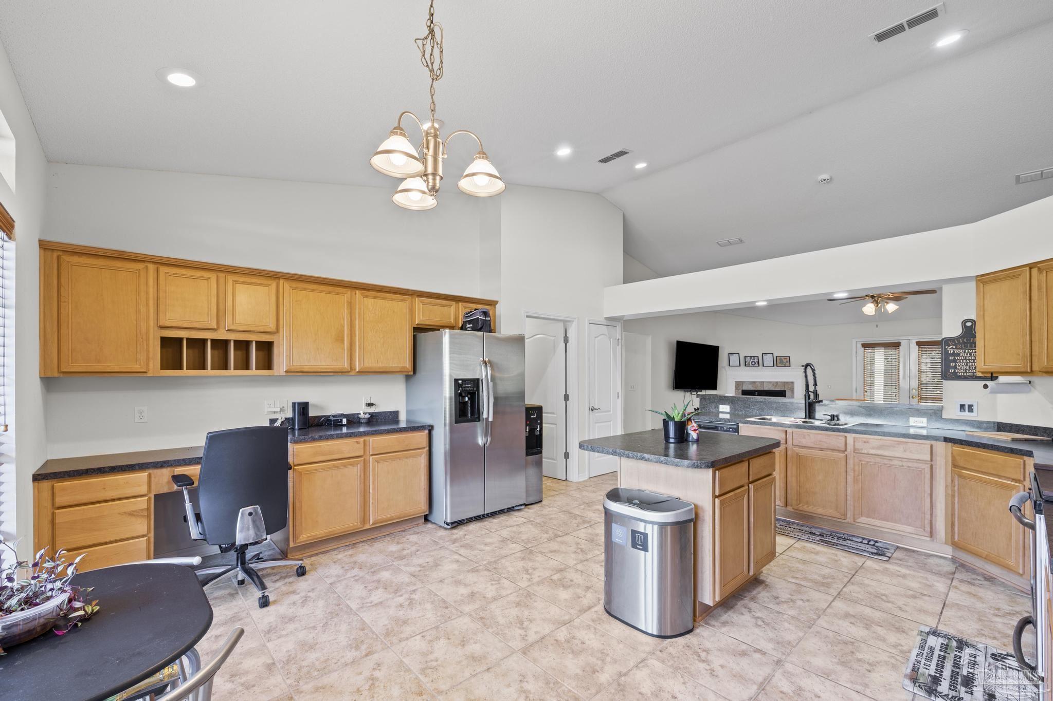 2165 Liberty Loop Road Cantonment, FL 32533 - Photo 22 of 51 a kitchen with a sink stove cabinets and refrigerator