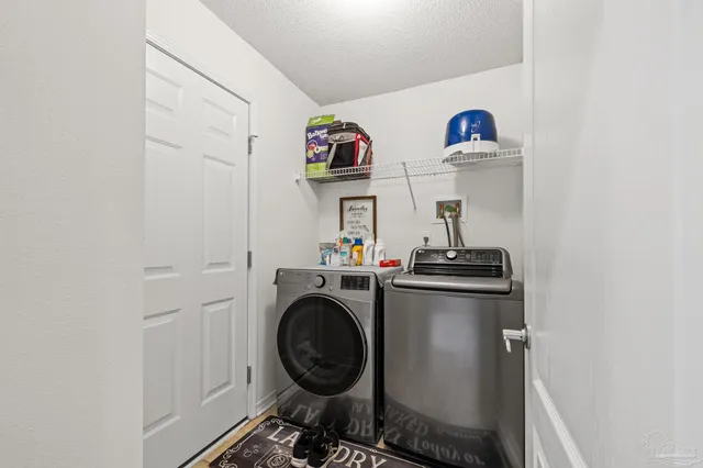 a view of a hallway with bedroom and wooden floor