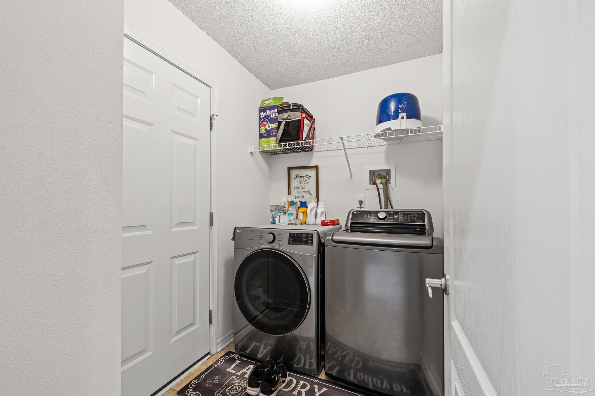 2165 Liberty Loop Road Cantonment, FL 32533 - Photo 28 of 51 a utility room with dryer and washer