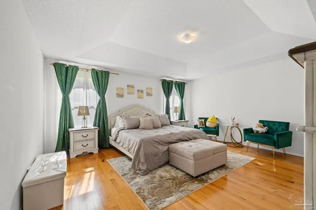 a bedroom with a bed and dresser