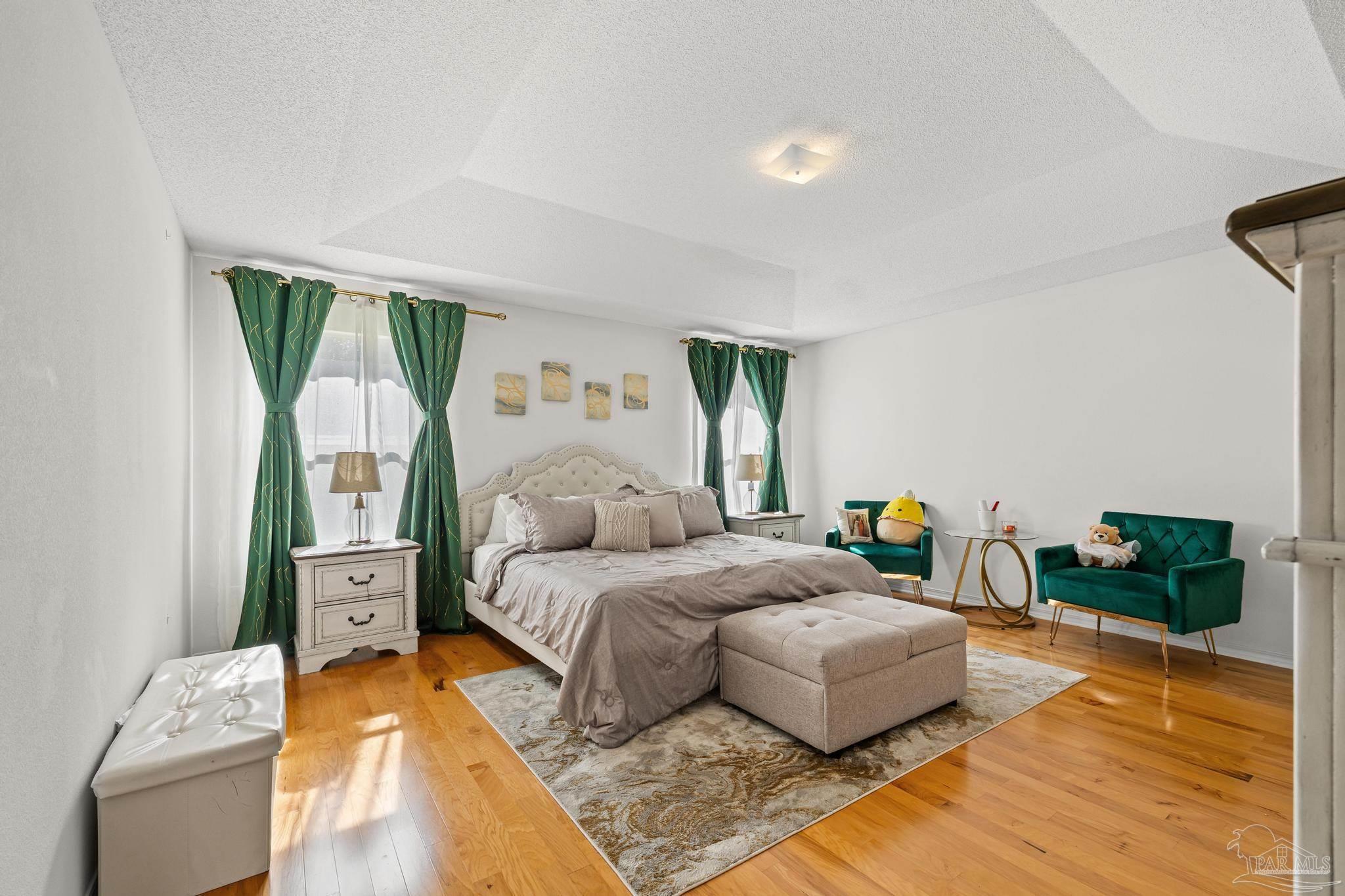 2165 Liberty Loop Road Cantonment, FL 32533 - Photo 36 of 51 a bedroom with a bed and wooden floor