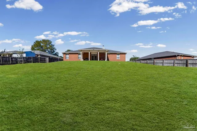 a view of a big yard with a house