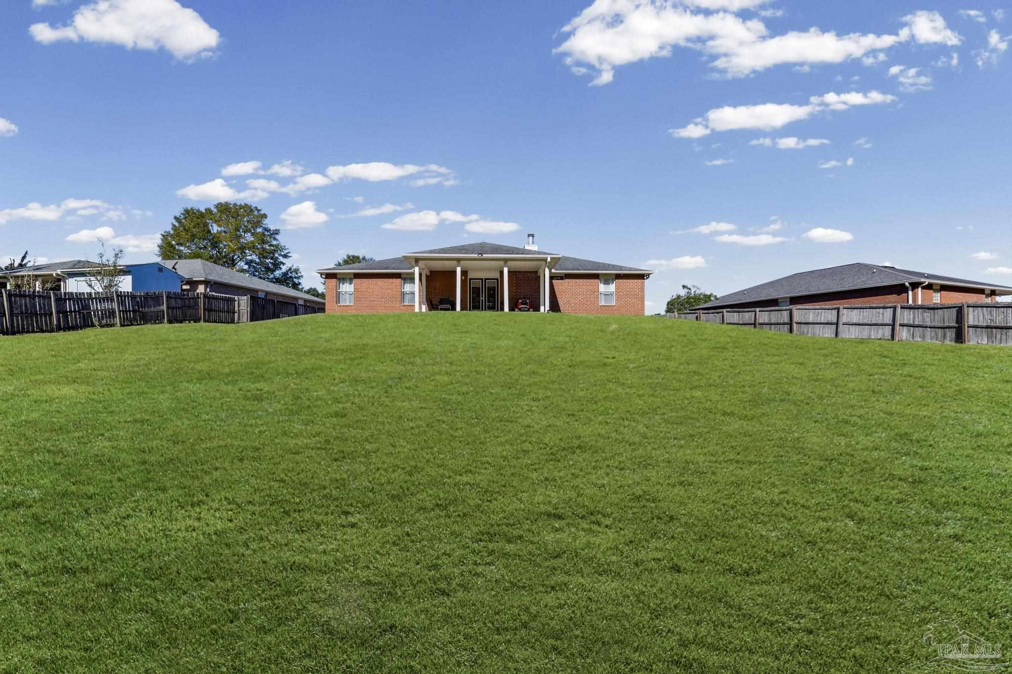 2165 Liberty Loop Road Cantonment, FL 32533 - Photo 47 of 51 a house view with a garden space