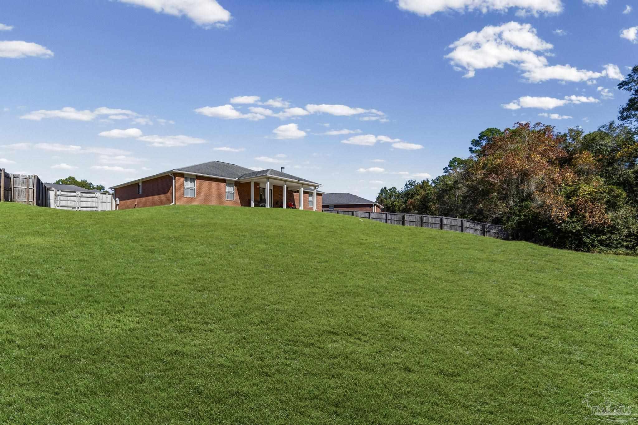 2165 Liberty Loop Road Cantonment, FL 32533 - Photo 48 of 51 a view of a big yard with a house