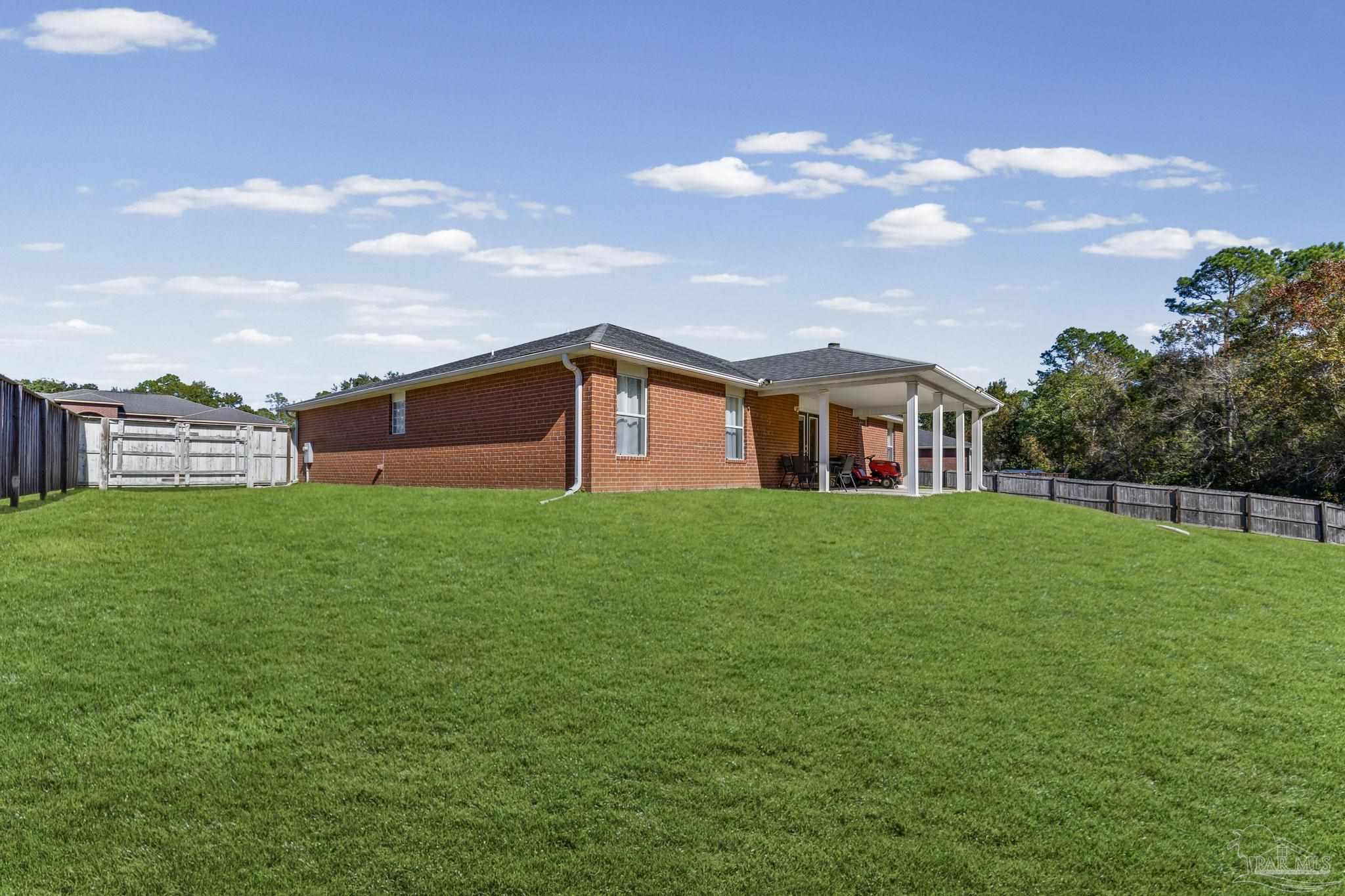 2165 Liberty Loop Road Cantonment, FL 32533 - Photo 49 of 51 a front view of house with a garden
