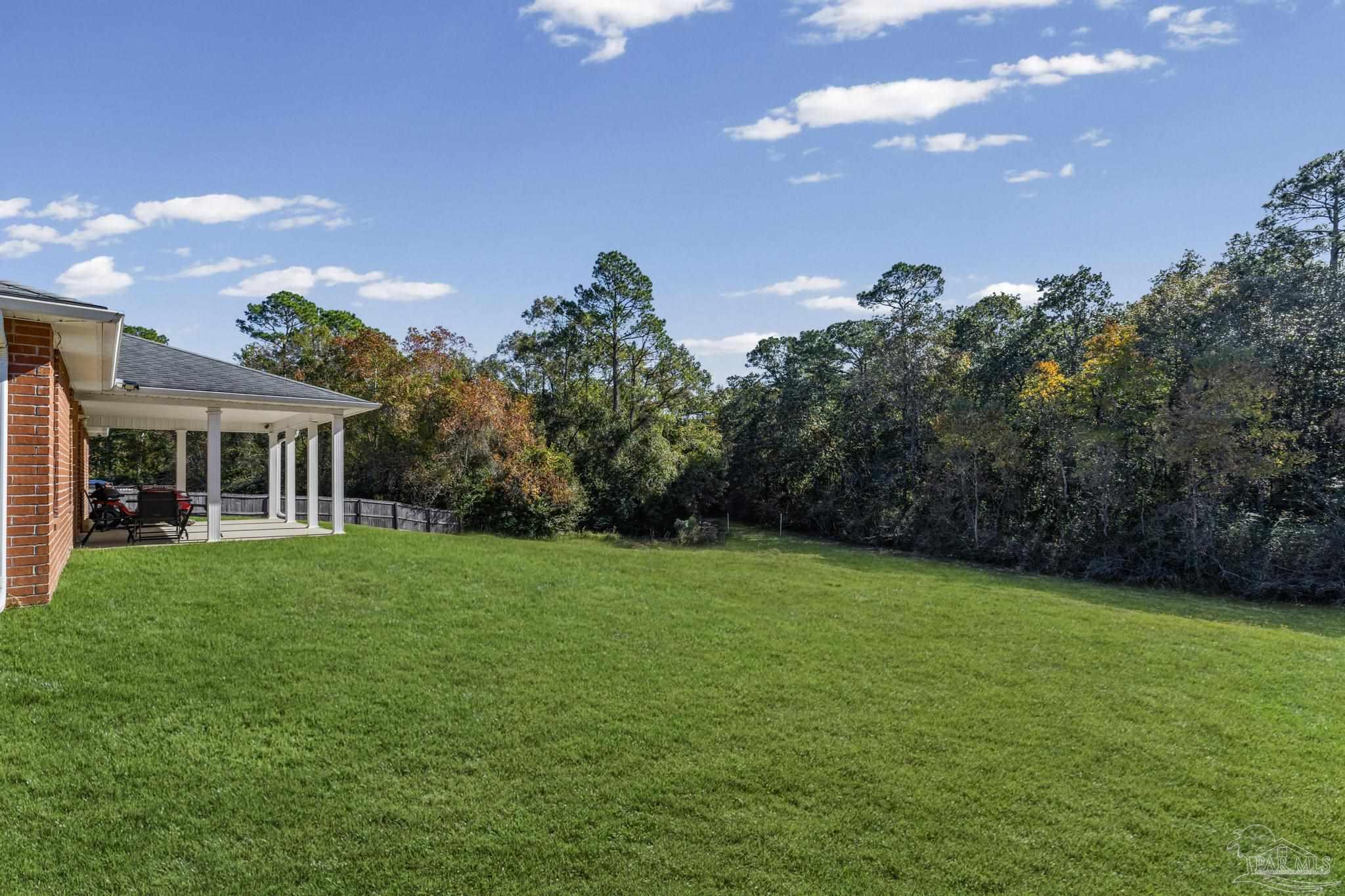 2165 Liberty Loop Road Cantonment, FL 32533 - Photo 50 of 51 a view of a house with a backyard
