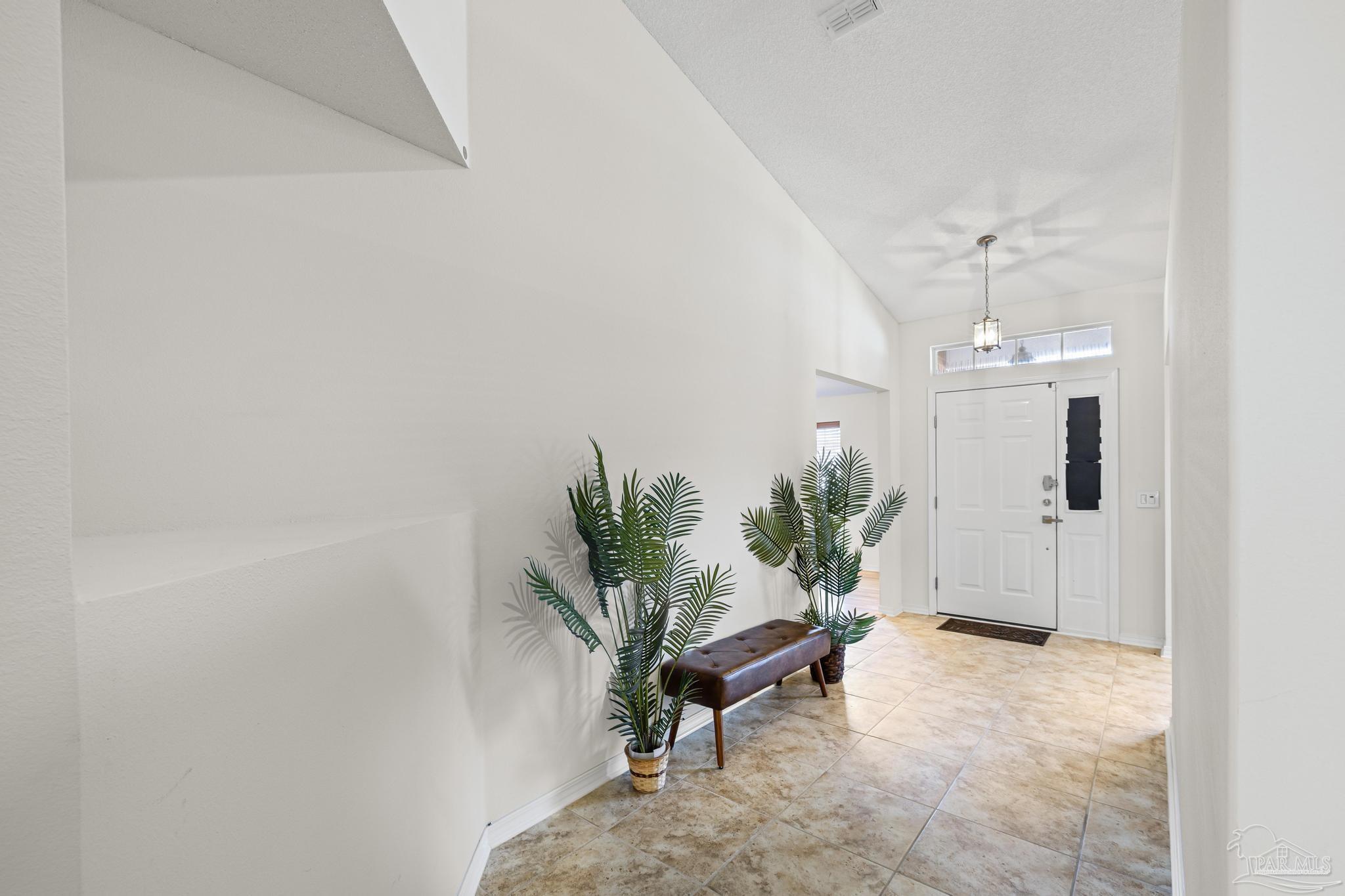 2165 Liberty Loop Road Cantonment, FL 32533 - Photo 8 of 51 a living room with furniture and a potted plant