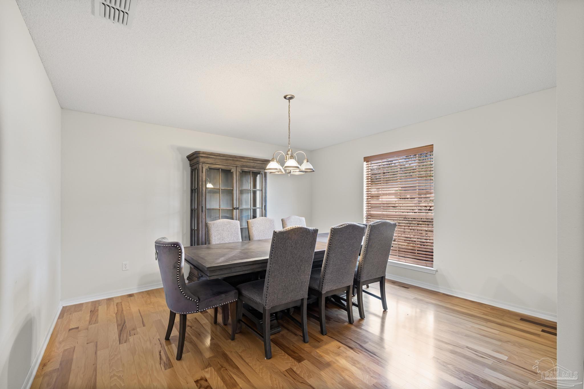2165 Liberty Loop Road Cantonment, FL 32533 - Photo 9 of 51 a dining room with furniture and window