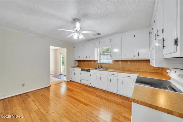 a large kitchen with cabinets