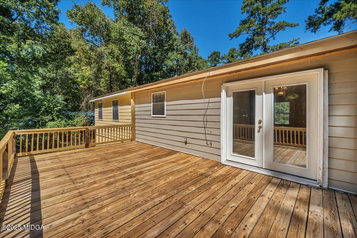 41 Golden Eye Monticello, GA 31064 - Photo 30 of 65 a view of backyard with a deck and wooden floor