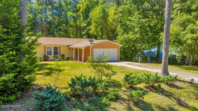 a aerial view of a chairs and table in the patio