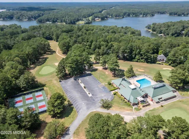 an aerial view of a house with outdoor space