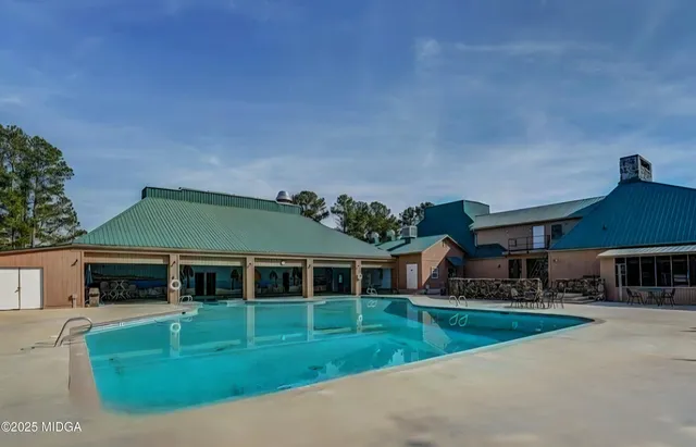 a view of outdoor space swimming pool and outdoor seating
