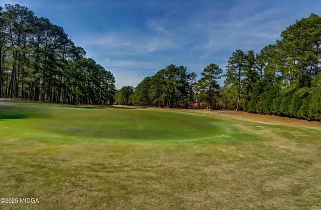 an aerial view of a house with outdoor space and lake view