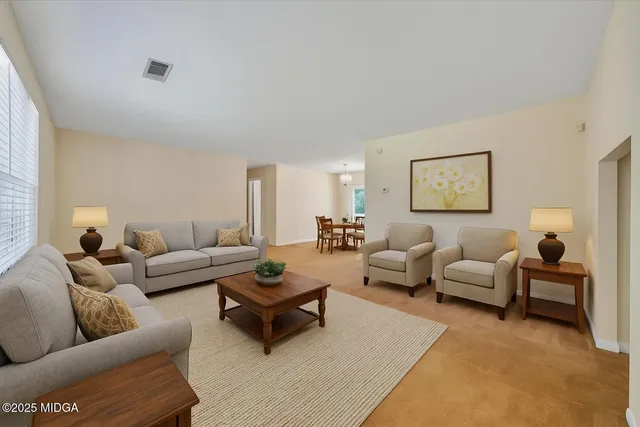 a living room with furniture and a couch