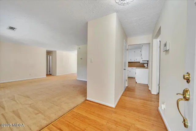 a view of a kitchen cabinets and wooden floor