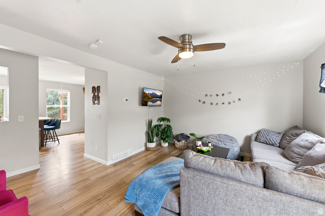 515 Inverness Lane, Unit 207 Heber City, UT 84032 - Photo 6 of 26 Living room featuring light wood finished floors and a ceiling fan