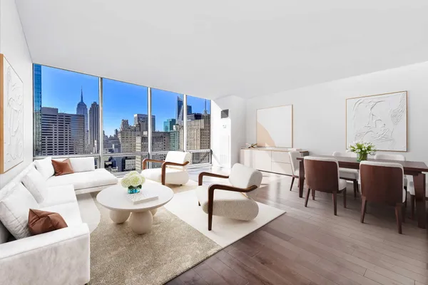 a living room with fireplace furniture and a wooden floor