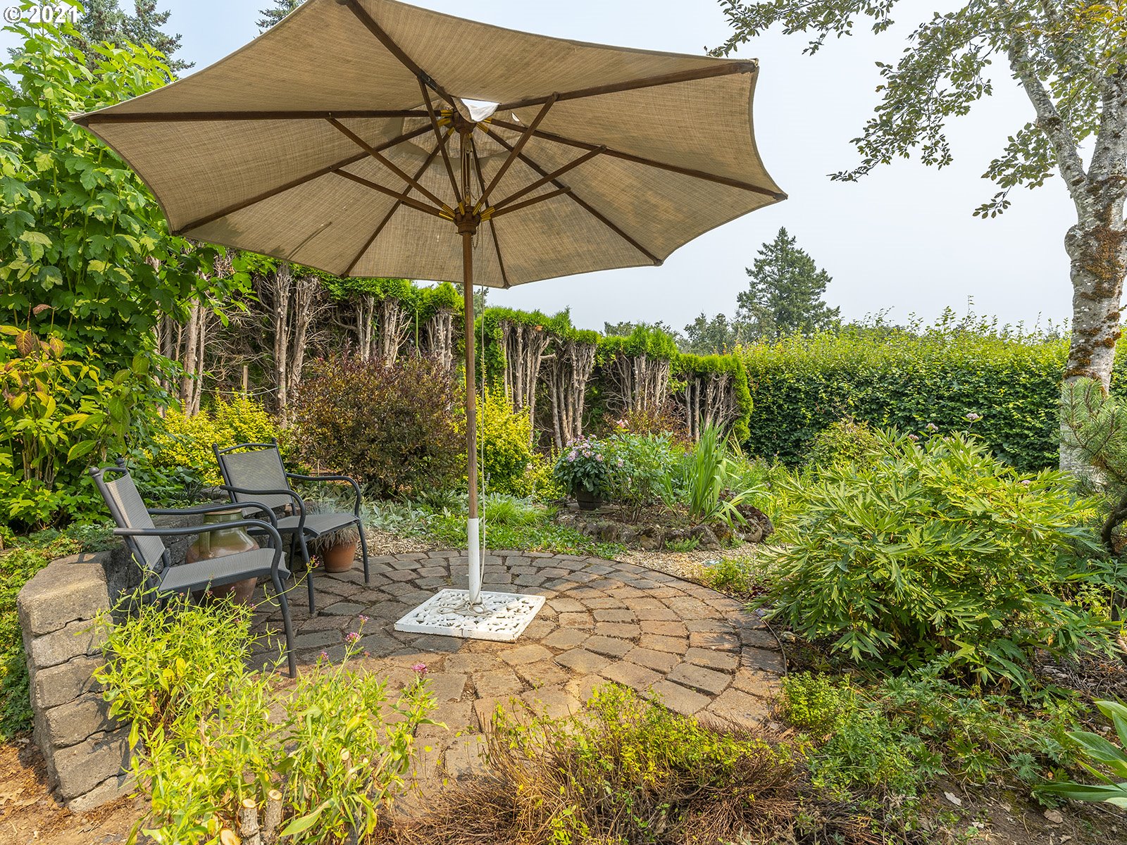 18350 Southwest Kramien Road Newberg, OR 97132 - Photo 23 of 31 a view of table and chairs under an umbrella