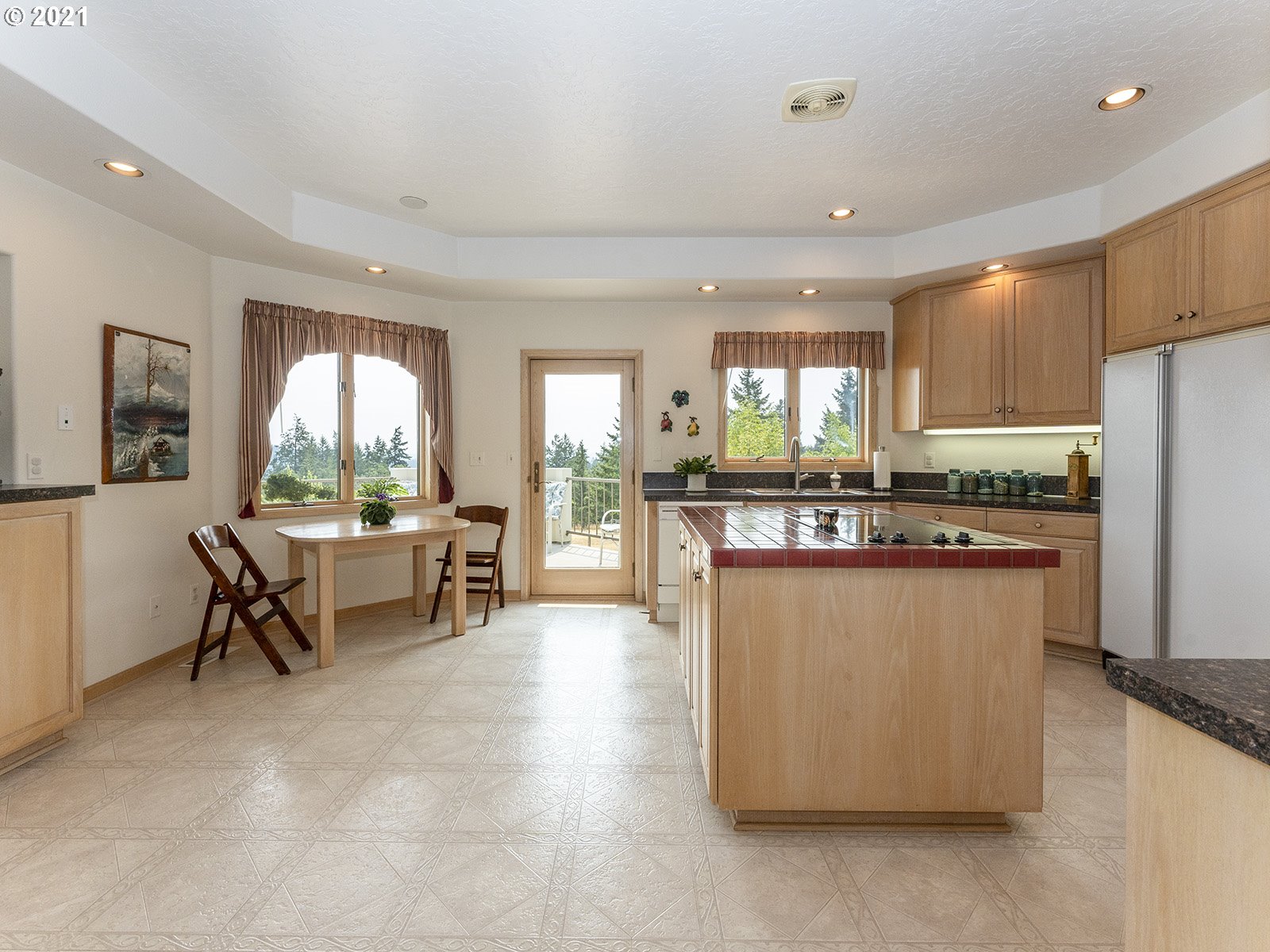 18350 Southwest Kramien Road Newberg, OR 97132 - Photo 6 of 31 a kitchen with kitchen island a counter top space a sink stainless steel appliances and cabinets