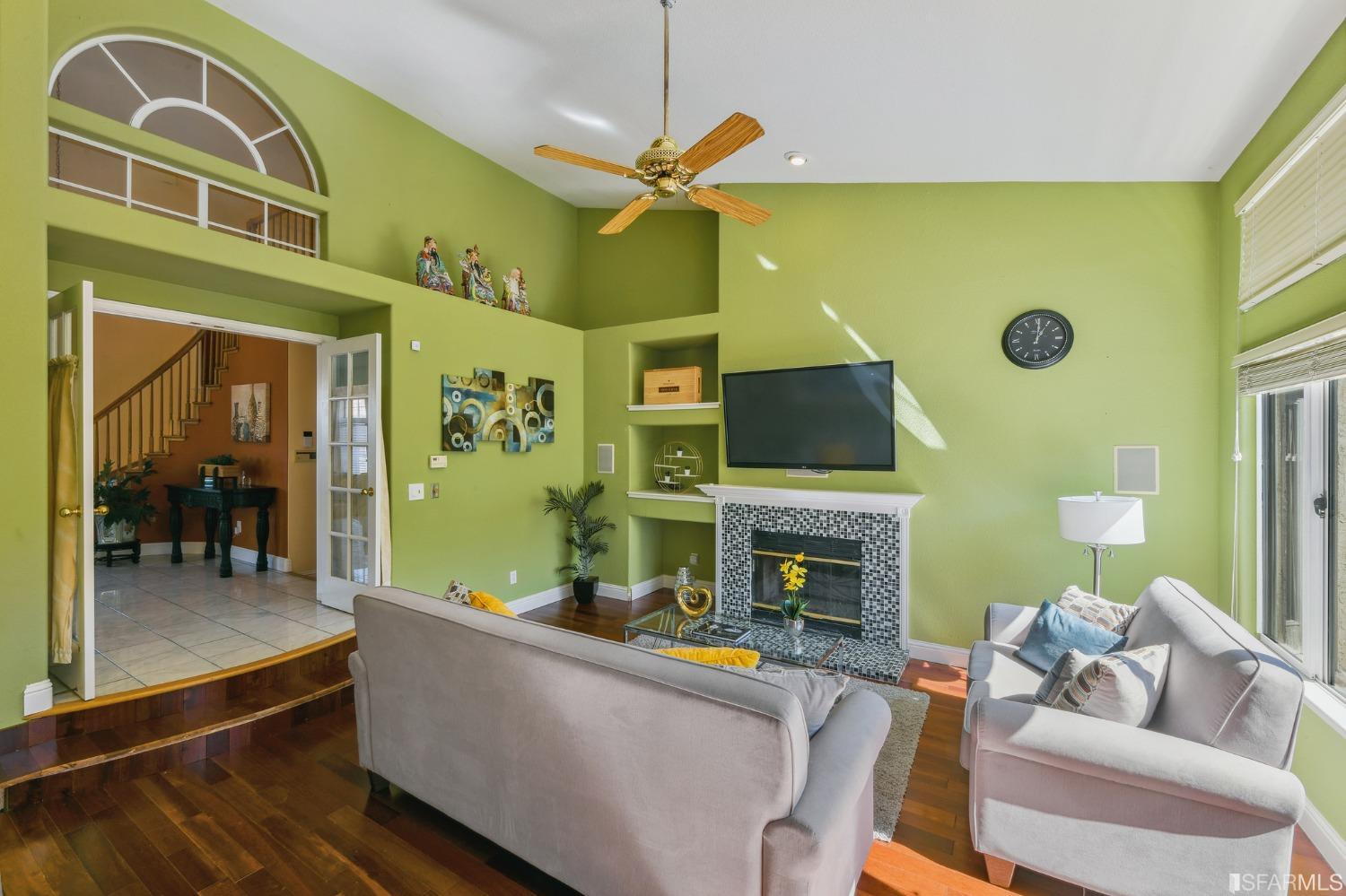 698 Turquoise Drive Hercules, CA 94547 - Photo 22 of 50 a living room with fireplace furniture and a flat screen tv