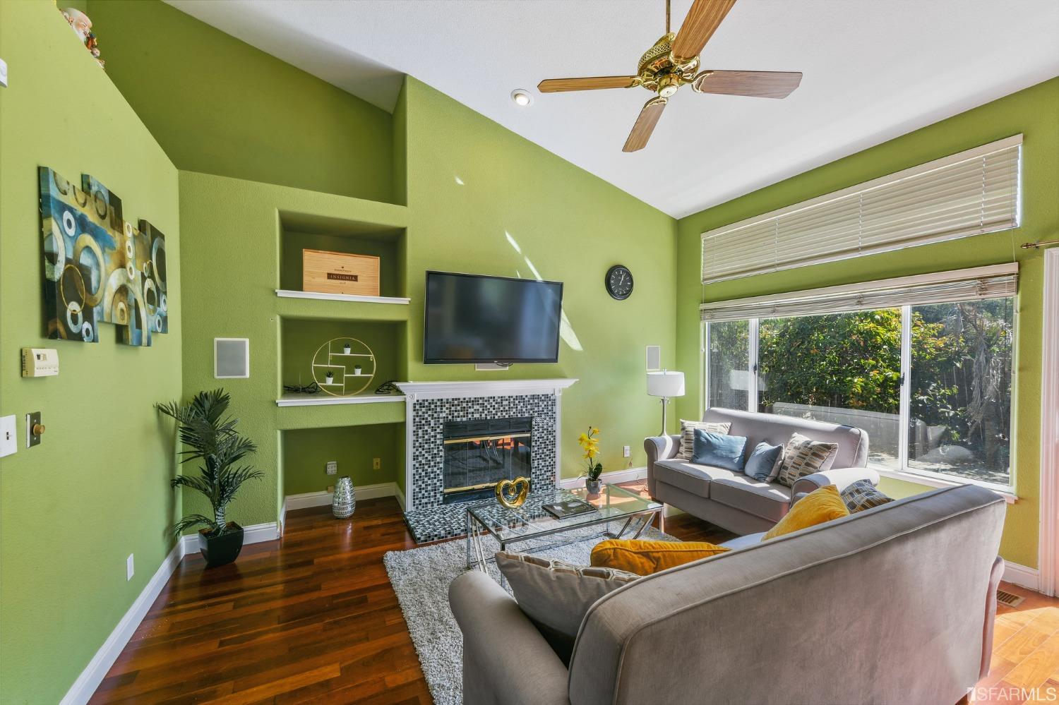 698 Turquoise Drive Hercules, CA 94547 - Photo 23 of 50 a living room with furniture and a fireplace