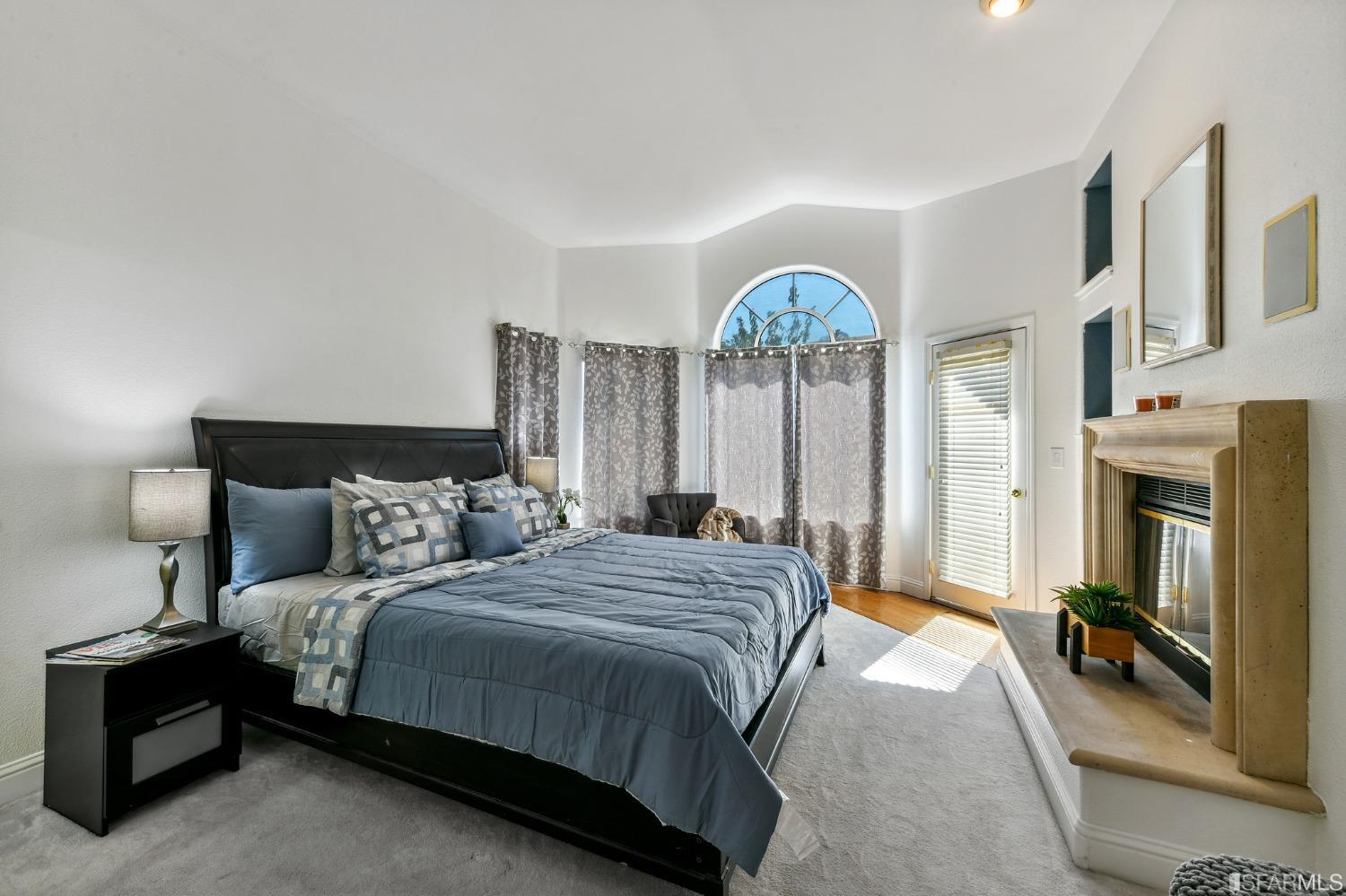 698 Turquoise Drive Hercules, CA 94547 - Photo 26 of 50 a bedroom with a bed and a chandelier