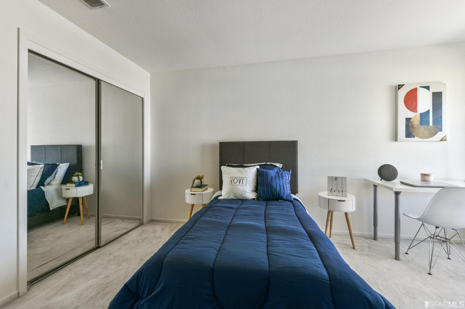 698 Turquoise Drive Hercules, CA 94547 - Photo 38 of 50 a bedroom with a bed and wooden floor