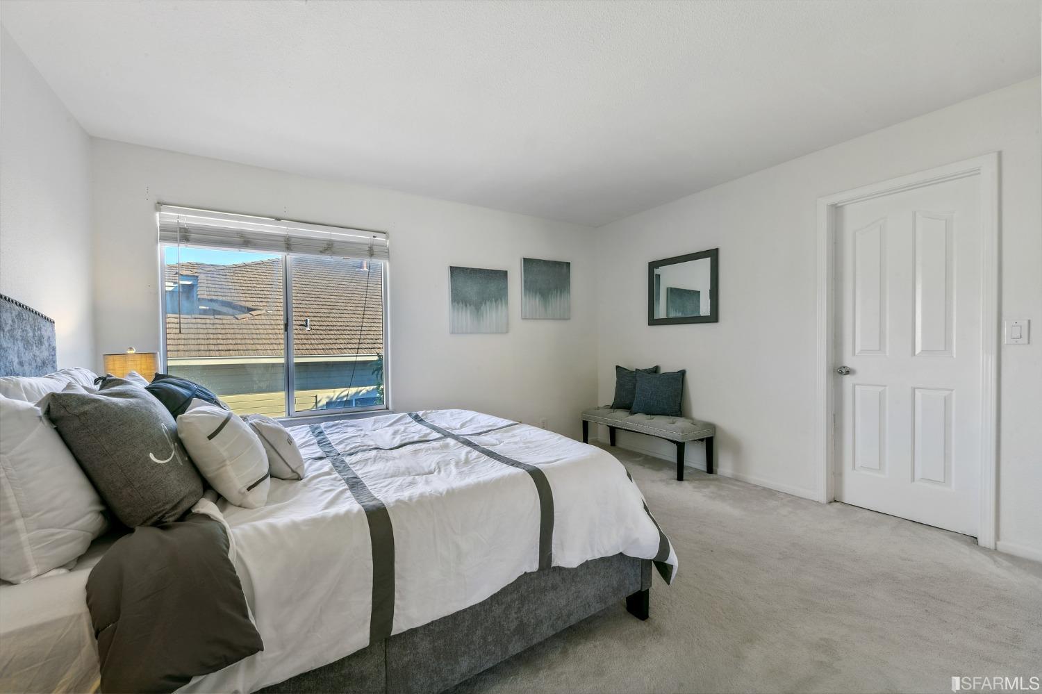 698 Turquoise Drive Hercules, CA 94547 - Photo 40 of 50 a bedroom with a bed and wooden floor