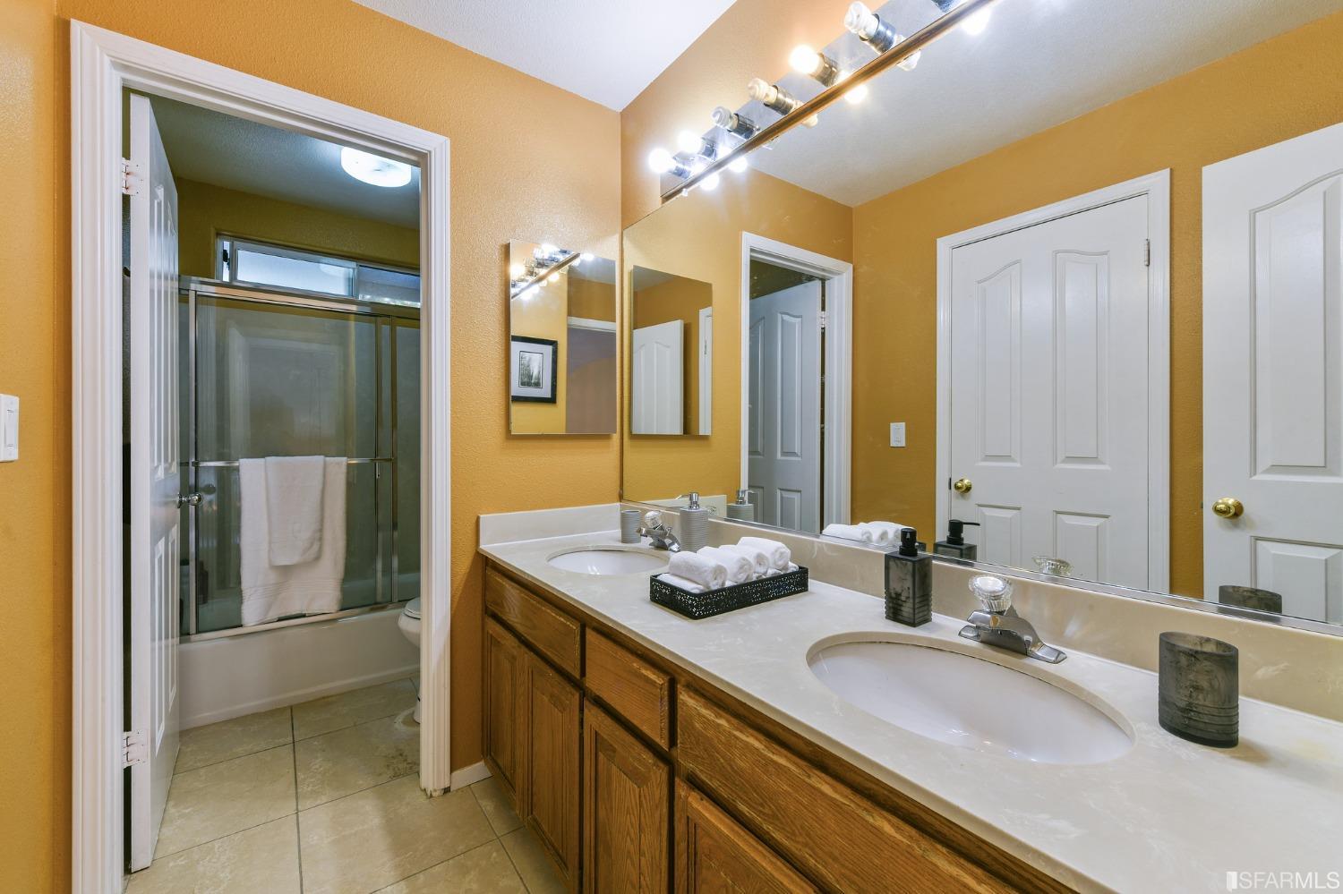 698 Turquoise Drive Hercules, CA 94547 - Photo 42 of 50 a bathroom with double vanity sinks and a mirror