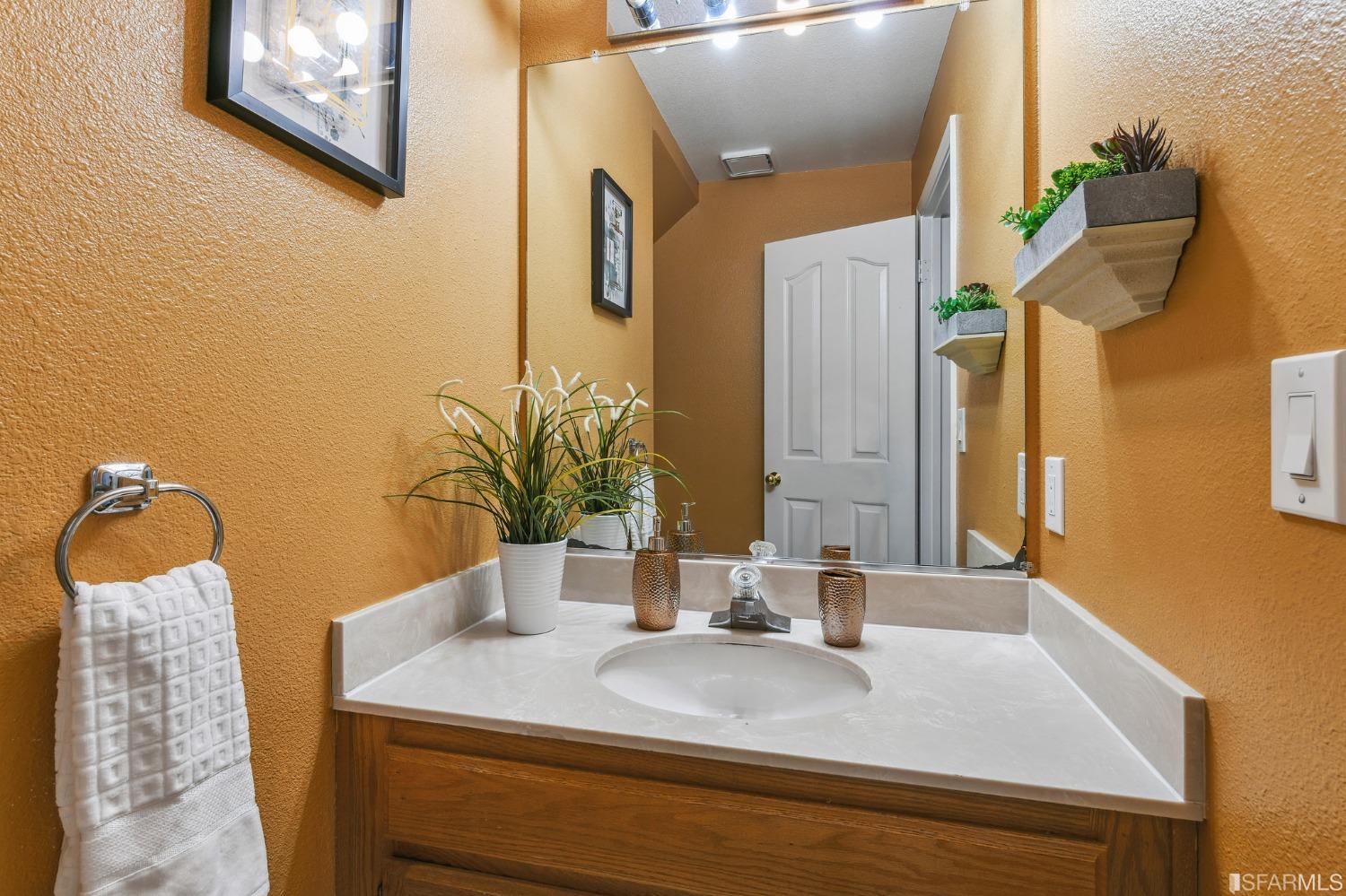 698 Turquoise Drive Hercules, CA 94547 - Photo 44 of 50 a bathroom with a sink and a mirror