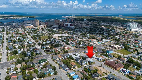 an aerial view of residential building and lake
