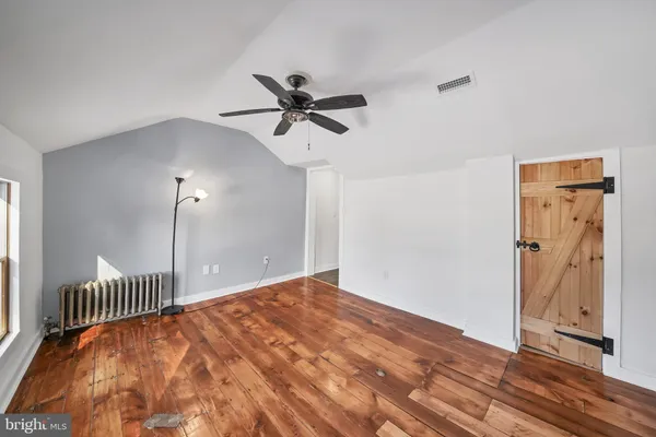 a view of a hallway with a chandelier