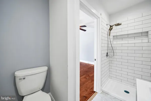 a bathroom with a toilet and shower