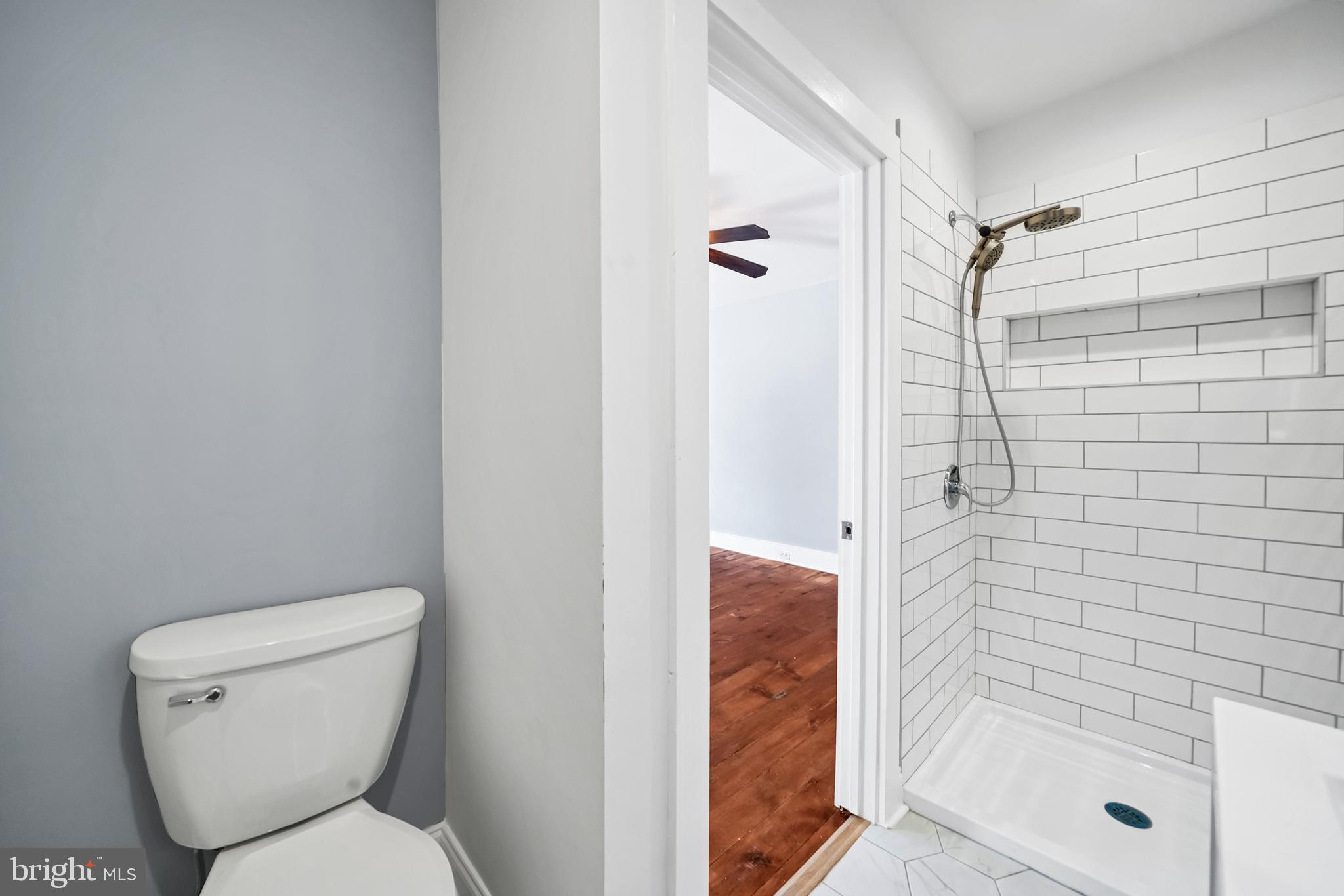 89 Asbury Broadway Road Asbury, NJ 08802 - Photo 19 of 49 a bathroom with a toilet and shower