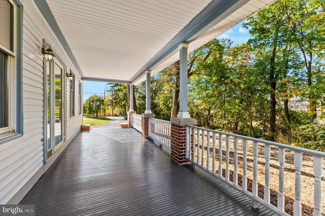 a view of porch with wooden floor