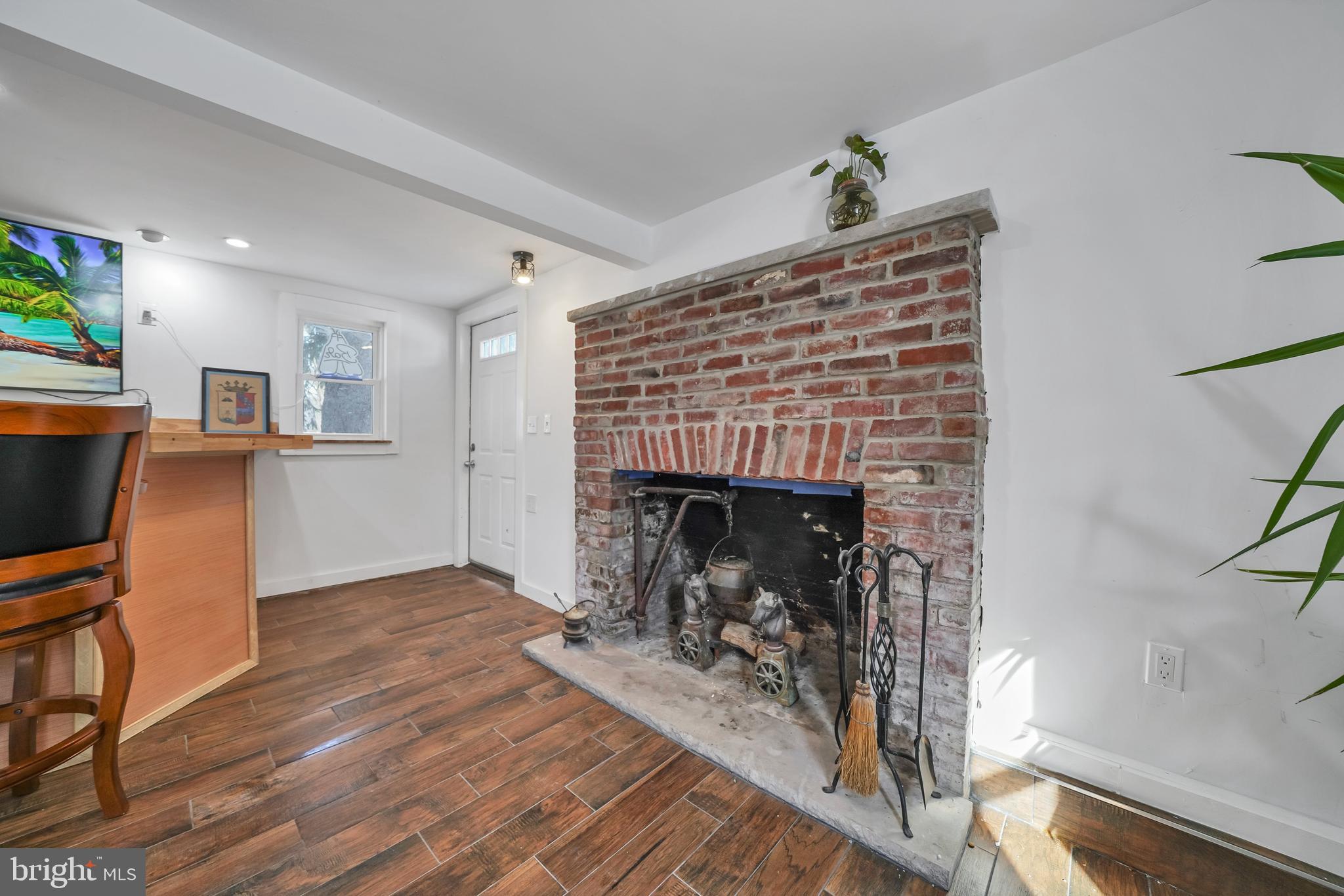 89 Asbury Broadway Road Asbury, NJ 08802 - Photo 27 of 49 a living room with furniture and a fireplace