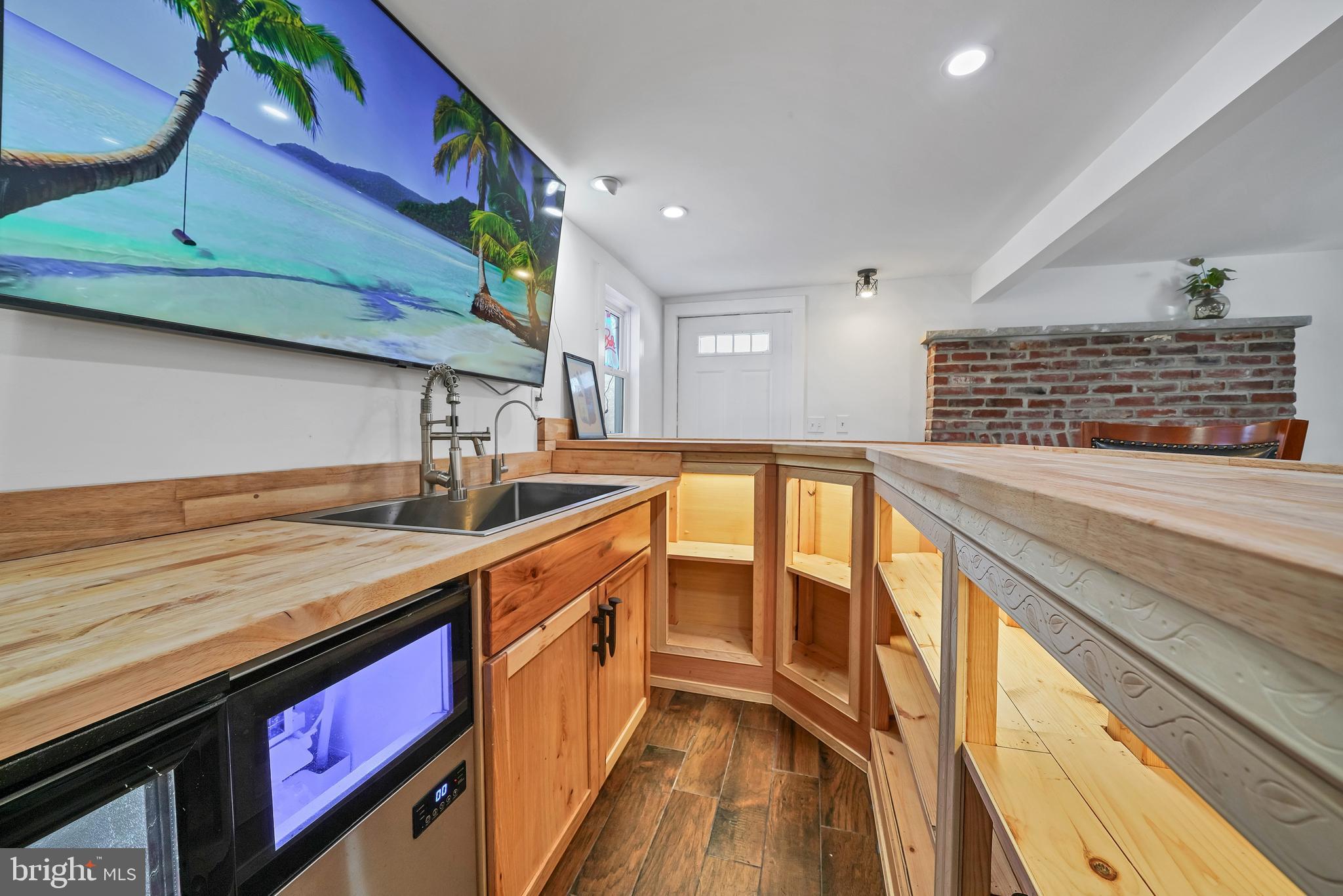 89 Asbury Broadway Road Asbury, NJ 08802 - Photo 28 of 49 a kitchen with stainless steel appliances granite countertop a sink and wooden cabinets