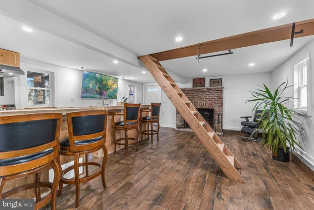 a dining room with furniture and a floor to ceiling window