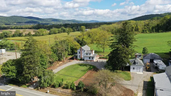 an aerial view of a house with a garden