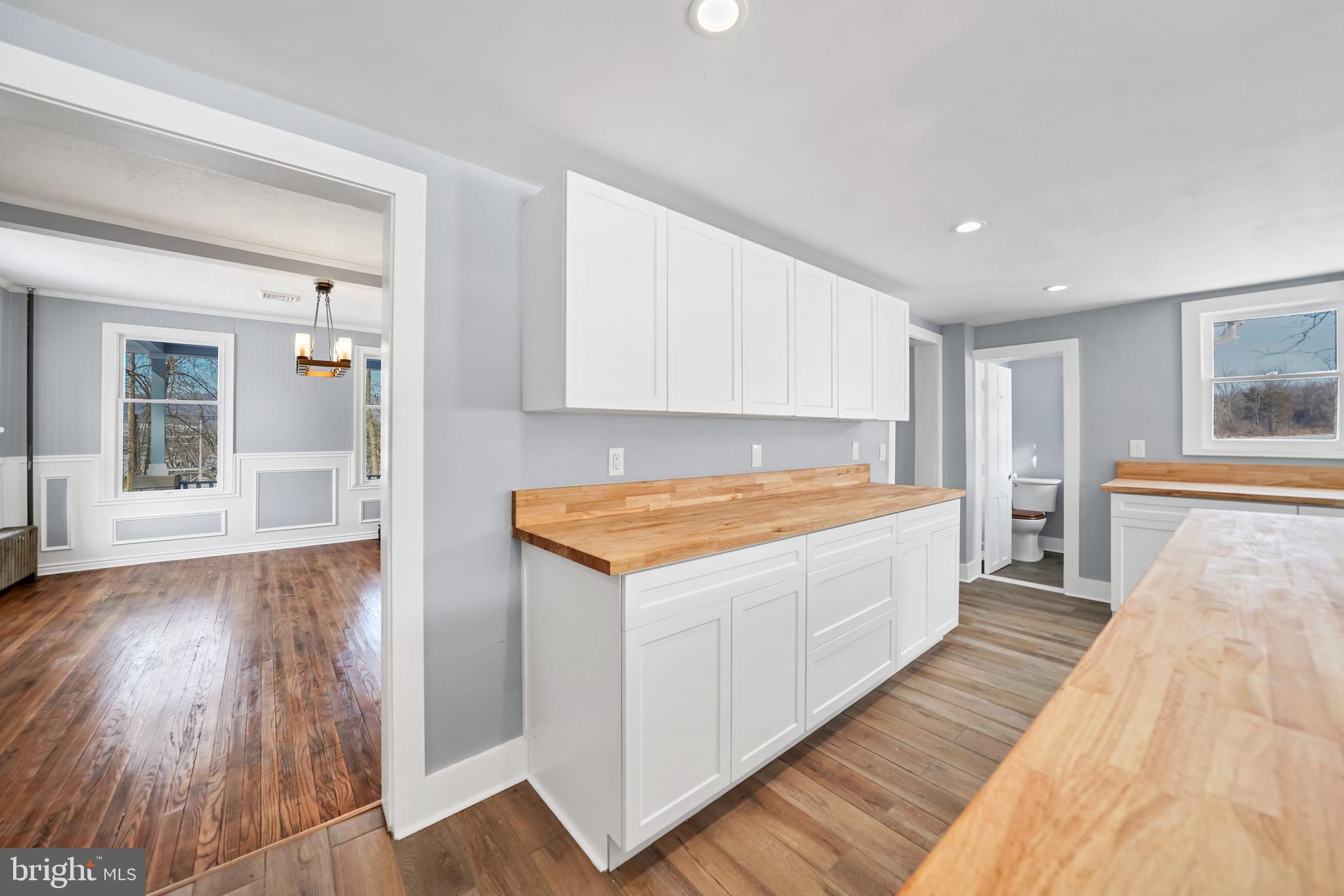 89 Asbury Broadway Road Asbury, NJ 08802 - Photo 5 of 49 a spacious bedroom with a bed and wooden floor