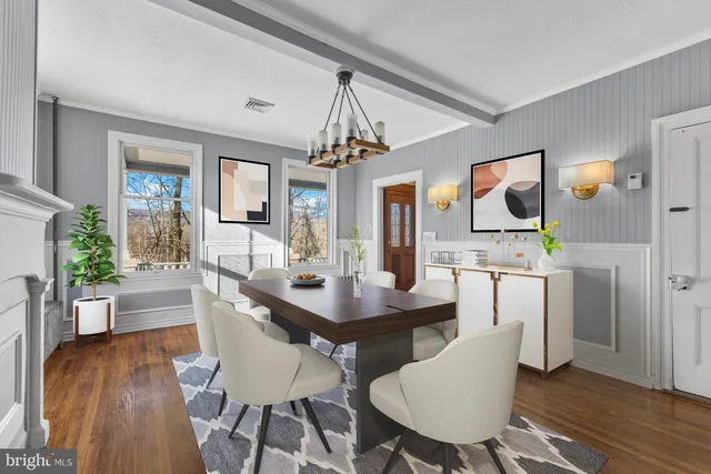a view of a dining room with furniture window and wooden floor