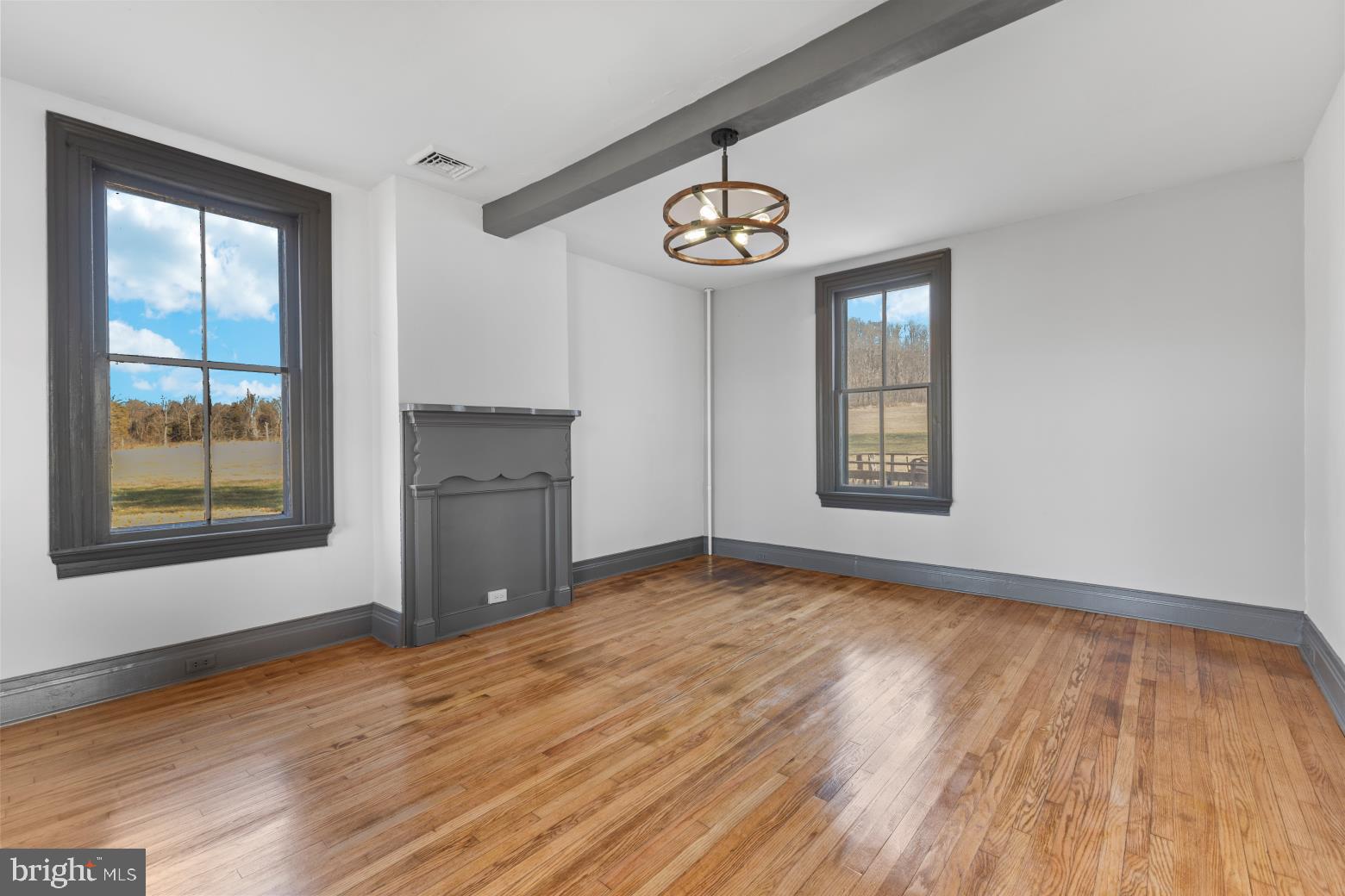 89 Asbury Broadway Road Asbury, NJ 08802 - Photo 10 of 49 a view of an empty room with a window and wooden floor