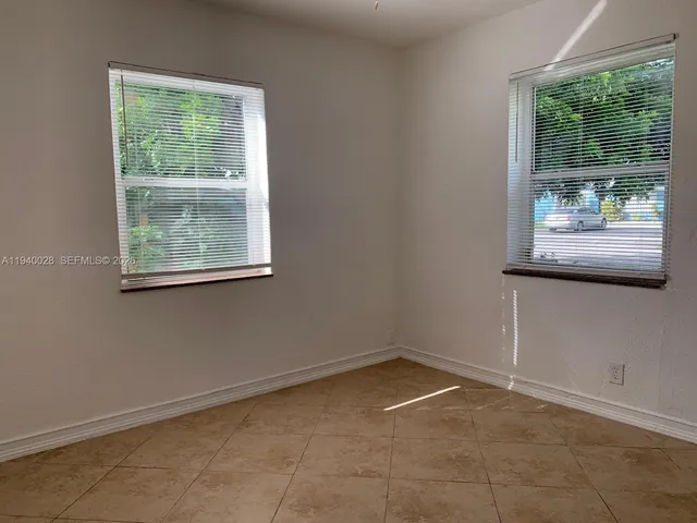 a view of a room that has a window in it