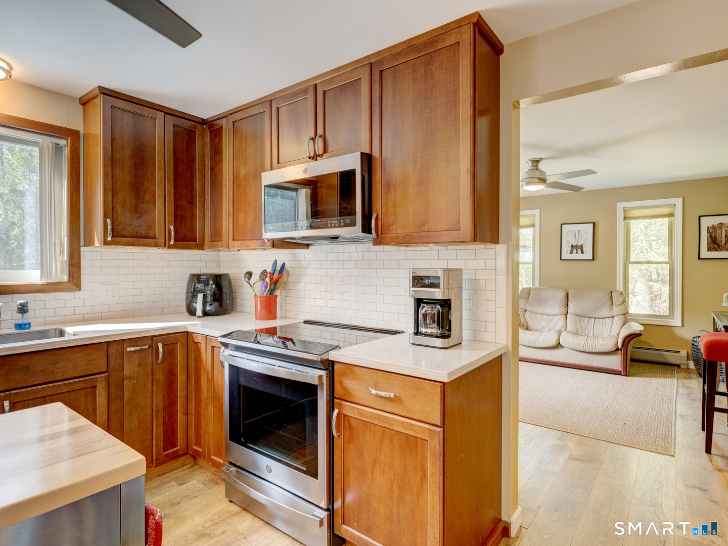 97 Lair Road New Hartford, CT 06057 - Photo 16 of 39 a kitchen with a sink stove and microwave