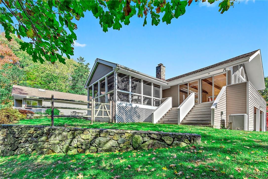 144 Salem Road Pound Ridge, NY 10576 - Photo 1 of 1 a front view of a house with garden