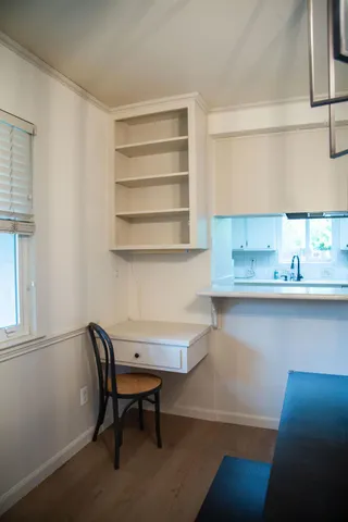 a view of a workspace with furniture