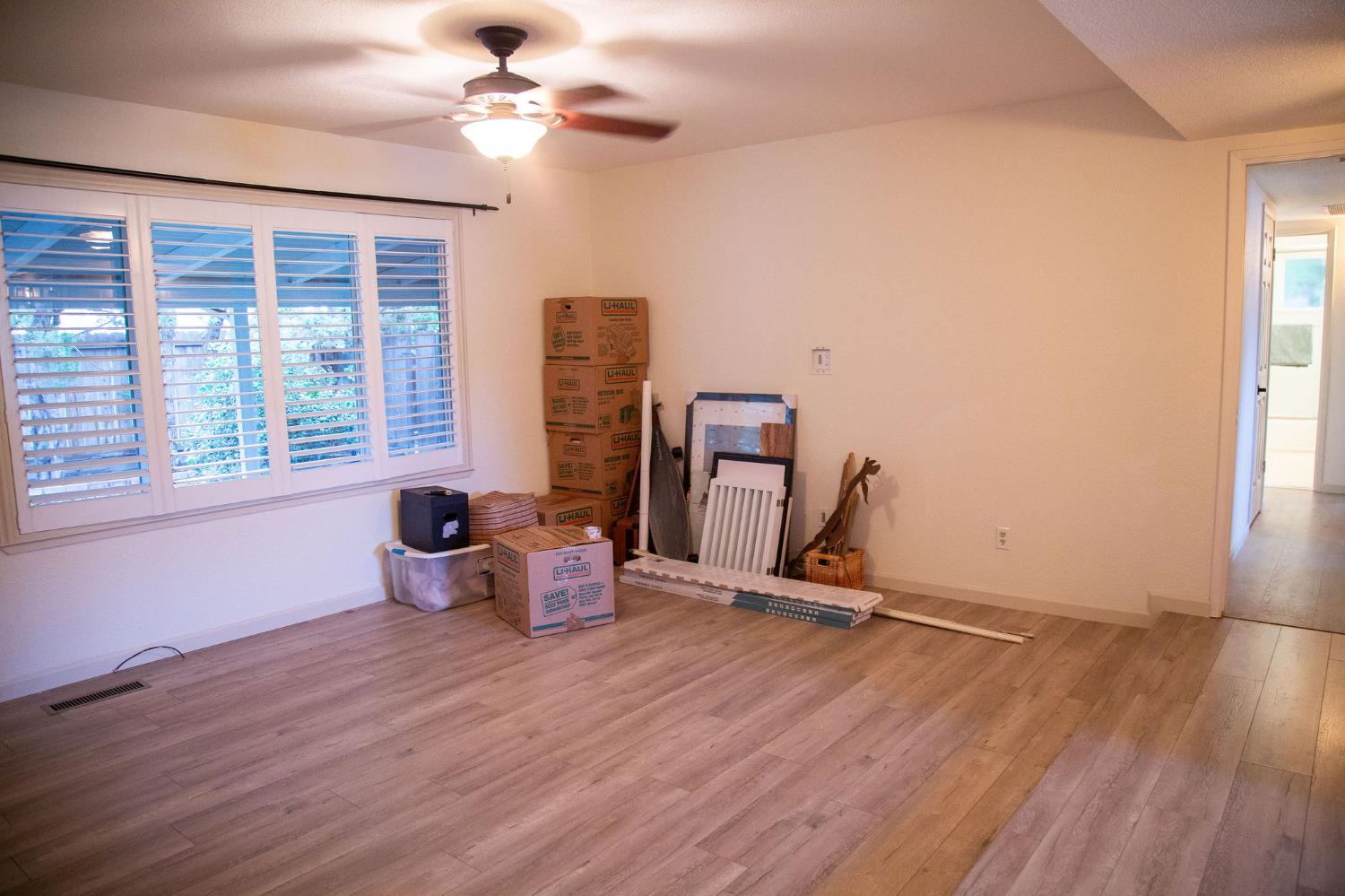 1208 Bristol Court Modesto, CA 95350 - Photo 16 of 40 Living room with vinyl plank floor, healthy amount of natural light, and ceiling fan
