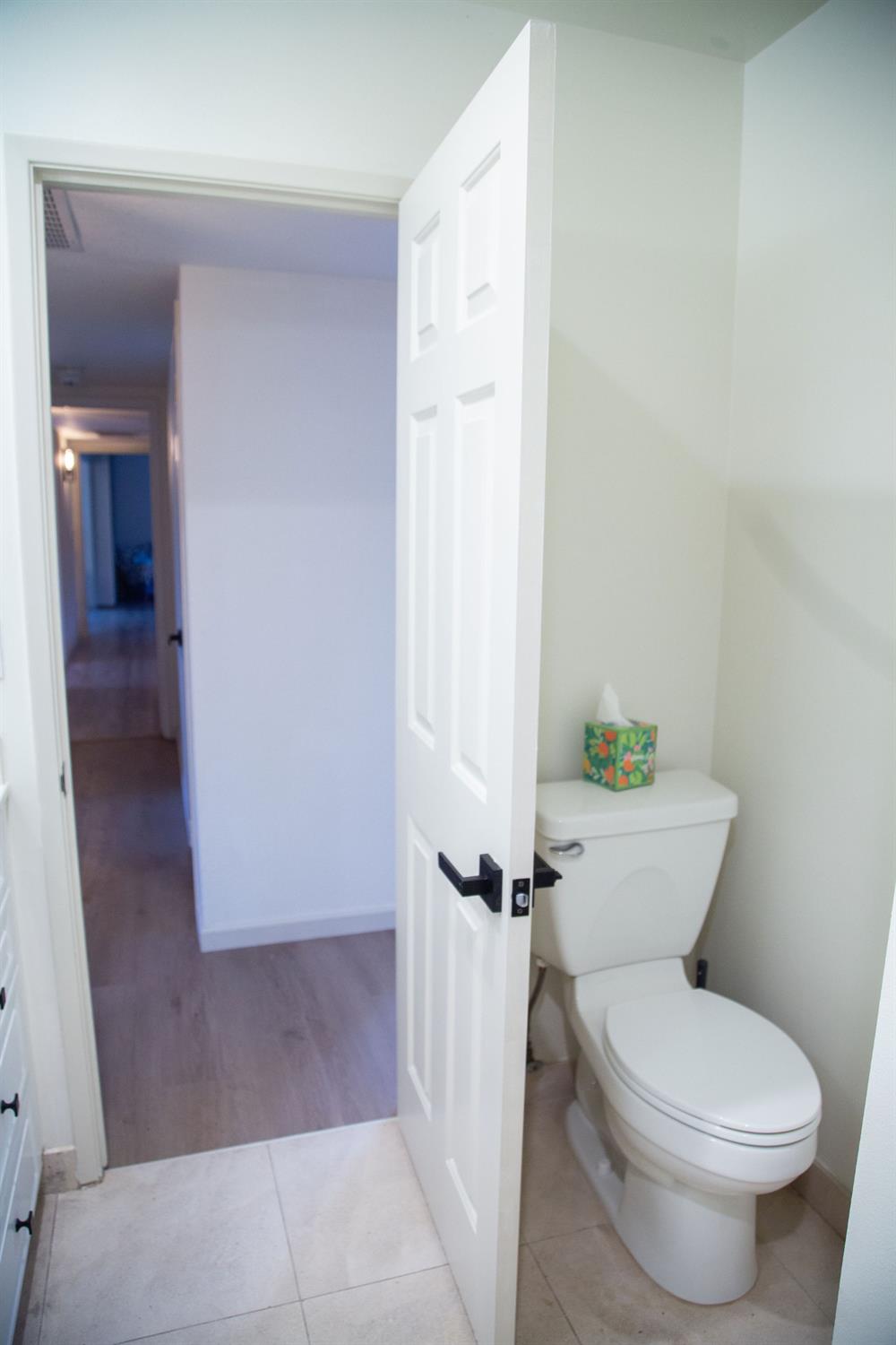 1208 Bristol Court Modesto, CA 95350 - Photo 23 of 40 bathroom #1 with light tile patterned floors and vanity