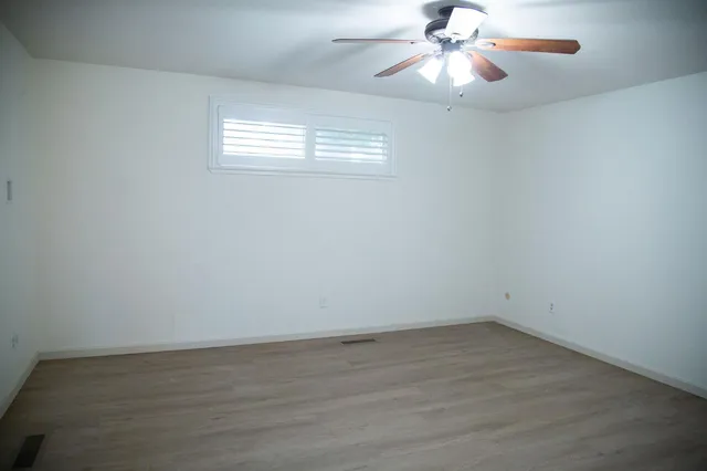a view of a livingroom with furniture and windows